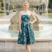 Woman standing in front of fountain.
